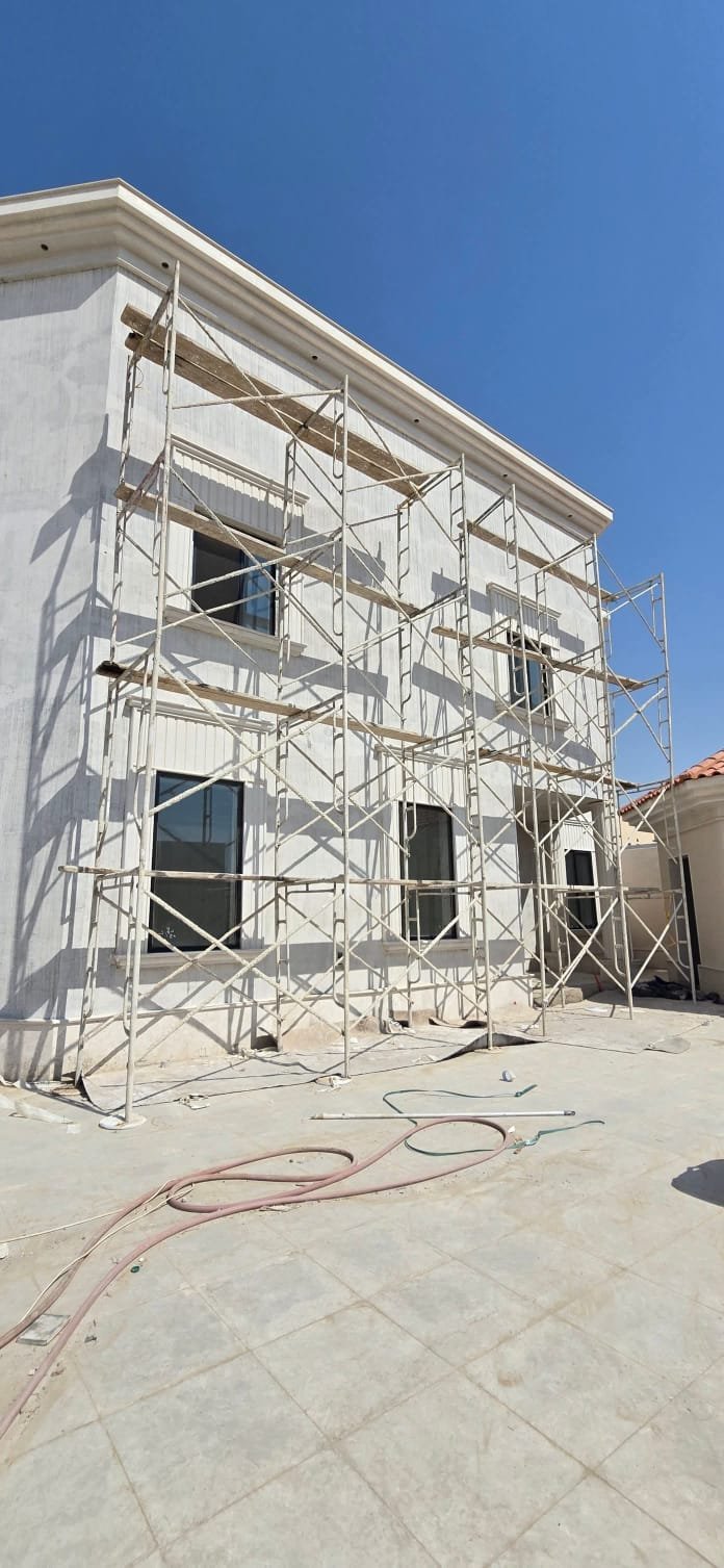 Fiber cement board exterior render installed on a villa facade in Riyadh